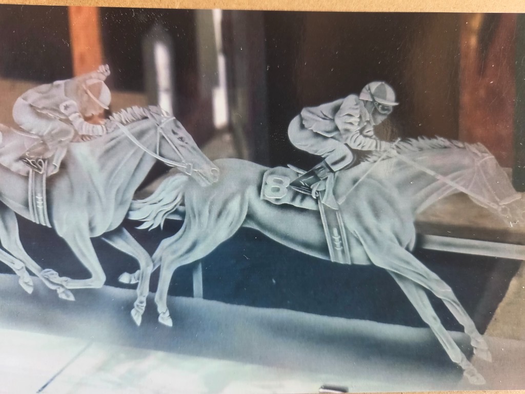 Historic etched glass panels of racehorses from the original Bully's Restaurant in Del Mar