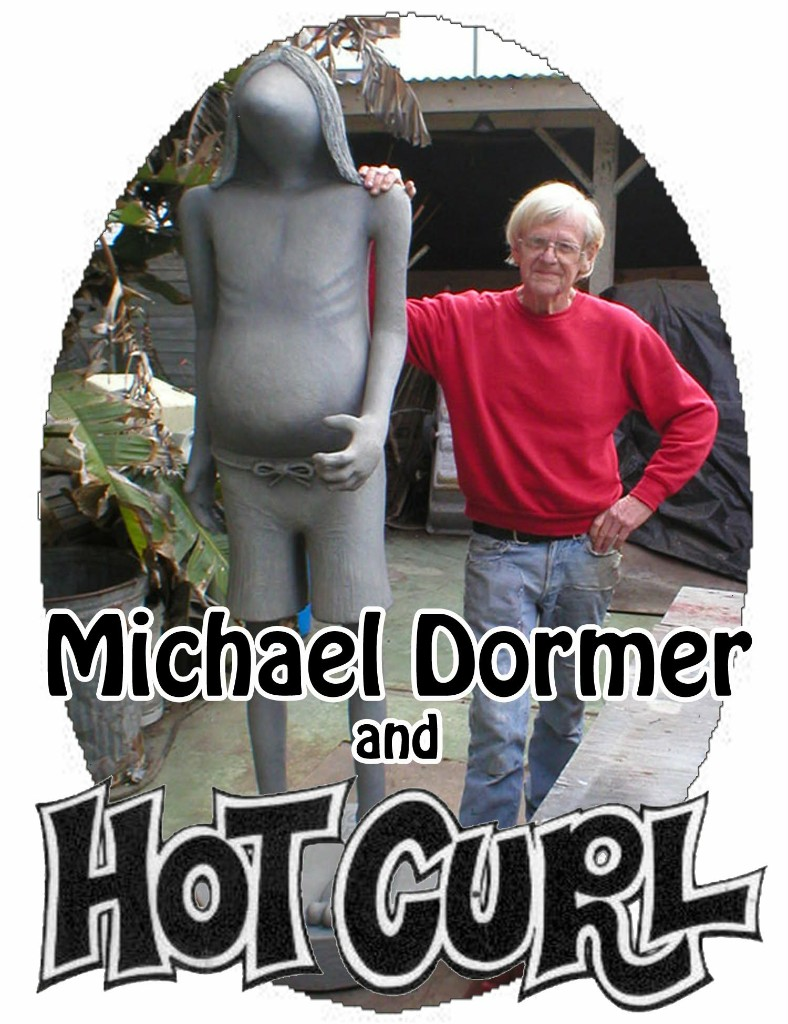 Mike Dormer standing beside a Hot Curl statue